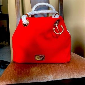 Brand new Michael Khors purse. Never used. A coral pink color